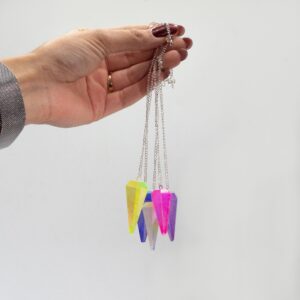 Pale green six sided pendulum with a gentle shimmer for calming focus.