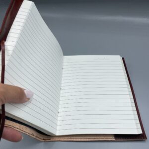 Large leather journal featuring an embossed Tree of Life design with a green stone accent.