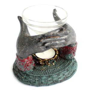 Antique Buddha oil burner with offering hands design for a serene atmosphere.