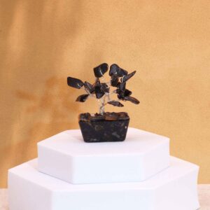 Mini gemstone tree featuring 15 black agate stones on an orgonite base.