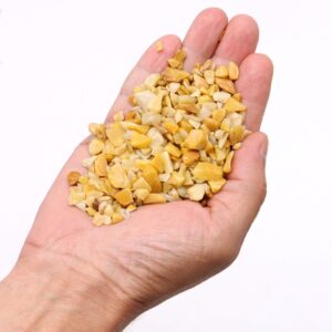 Golden Quartz Chips in a bulk bag, showcasing their warm, sunlit tones.