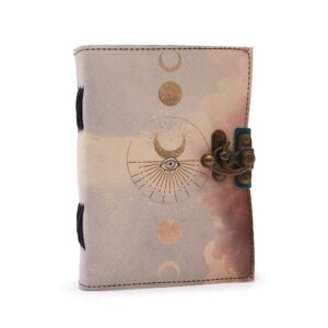 Leather notebook with moon phases design and deckle-edge pages.