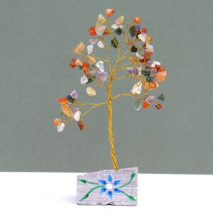 Handmade Indian gemstone tree with vibrant stones on a rock base.