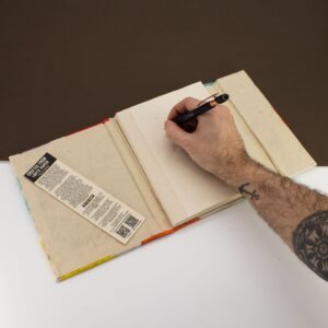 Large Lokta notebook with colourful leaf designs, perfect for creative writing.