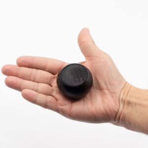 Compact mini wireless speaker in a modern design, perfect for travel and home use.