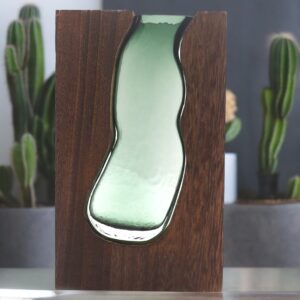 Large glass vase in dark tung wood frame, perfect for modern decor.