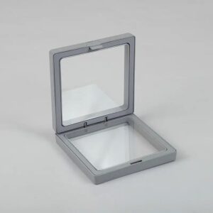 Grey 3D floating frame display showcasing jewellery and small treasures.