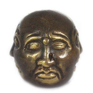 Brass Four Face Buddha ornament for home decor and relaxation.