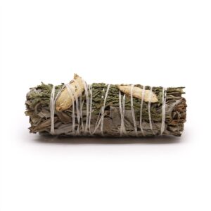 Smudge stick made with white sage, ginger, and cedar for cleansing spaces.