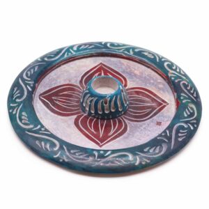 Soapstone disc incense holder with a four petal design for cones and sticks.