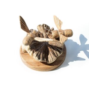 Hand-carved wood art featuring two bees on a textured base.
