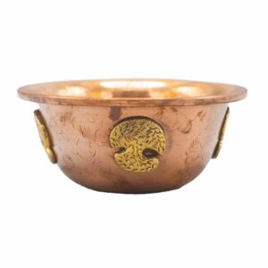 Copper ritual bowl featuring a Tree of Life design with raised symbols.