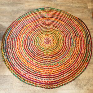 Handmade round jute and recycled cotton rug, soft and durable, perfect for living spaces.