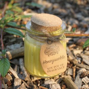 Honeysuckle soy candle in a reusable glass jar with cork lid and jute twine.
