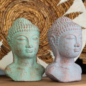 Green copper Buddha head statue with a weathered finish for serene decor.