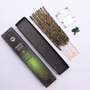 Spicy Smudge Incense sticks with jade chipstones in a serene setting.