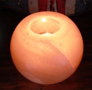 Unique round Himalayan salt candle holder with natural cracks and veins.