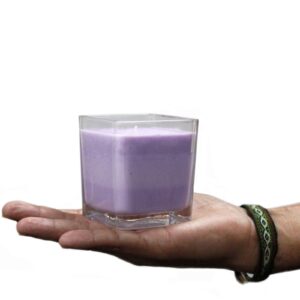 Lavender and basil scented soy wax jar candle in a clear glass container.
