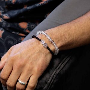 Gemstone double power bracelets featuring clear rock quartz and colourful strings.