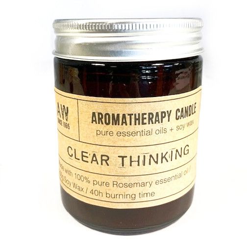 Amber glass jar aromatherapy candle for clear thinking and relaxation.