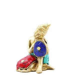 Brass Buddha figure in a thoughtful pose, perfect for home decor.