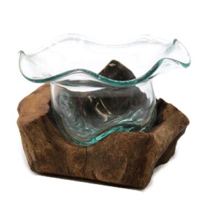 Handcrafted molten glass bowl on a wooden base, perfect for home decor.