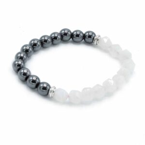 Faceted rose quartz bracelet with sparkling beads reflecting light.
