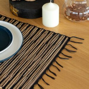 Black Tiger patterned water hyacinth placemat with fringed edges.