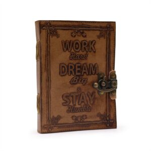 Handmade leather journal with embossed motivational message on the cover.