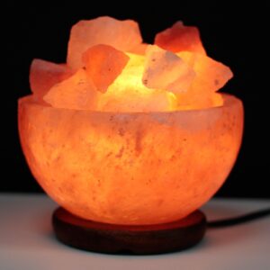 Himalayan crystal salt bowl with chunks, perfect for home fragrance and relaxation.