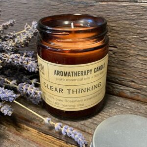 Amber glass jar aromatherapy candle for clear thinking and relaxation.