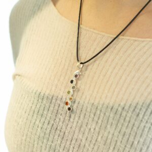 Silver plated Indian pendant featuring a flowing snake design with seven coloured stones.