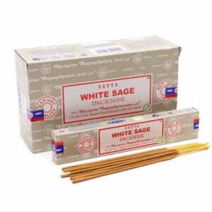 Hand-rolled Satya Incense sticks in a natural setting, showcasing White Sage aroma.
