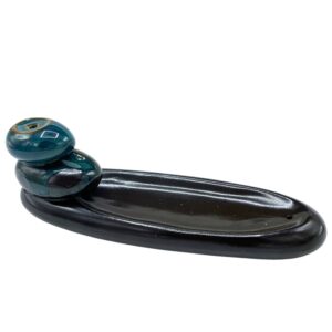 Elegant backflow incense burner designed with zen pebbles for a calming atmosphere.