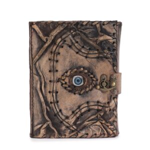 Brown tan book featuring evil eye decor with deckle edge pages.