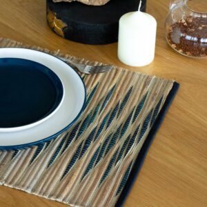 Handcrafted blue waves placemat made from sustainable water hyacinth.