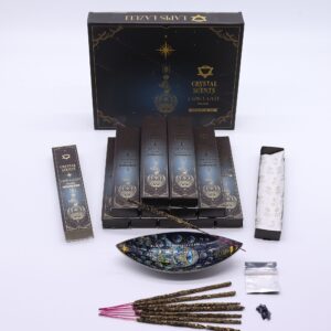 Musk smudge incense sticks with lapis lazuli chipstones in a serene setting.