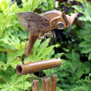 Handmade coconut owl wind chimes for garden decor and relaxation.