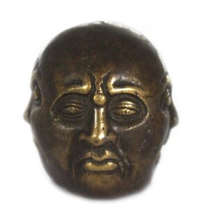Brass Four Face Buddha ornament for home decor and relaxation.