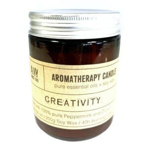 Amber glass jar aromatherapy candle designed to inspire creativity.