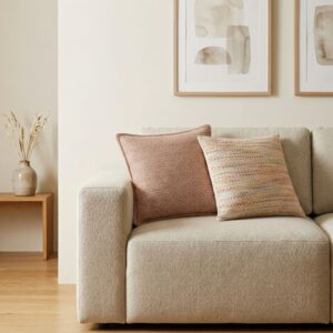 Burgundy squares cushion cover adding elegance to a living space.