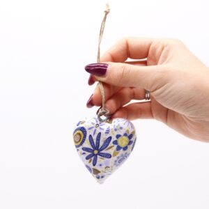 Large wooden heart decor featuring a blue floral design for home styling.