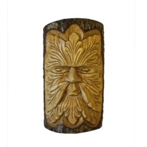 Intriguing Green Man tree trunk carving for garden or home decor.