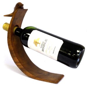 Handcrafted wooden dolphin wine holder showcasing unique grain patterns.