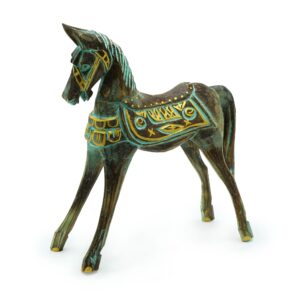 Handcrafted decorative horse in gold and turquoise, showcasing intricate carvings.