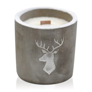 Wooden Wick Concrete Candle with Stag Head design in a rustic setting.
