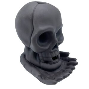 Elegant backflow incense burner shaped like a weeping skull with light feature.