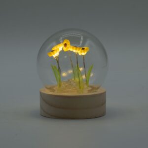 Floral Glow Garden Dome featuring five sunflowers under a glass dome with LED light.