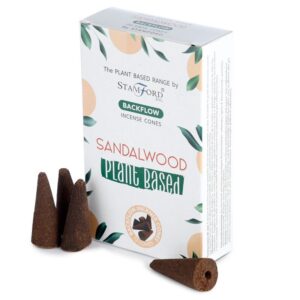 Sandalwood backflow incense cones arranged in a decorative setting.