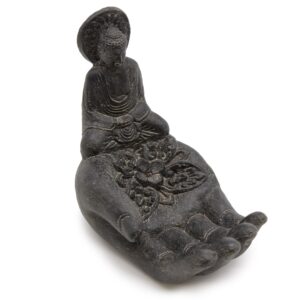 Elegant black Buddha and hand incense burner for a calming atmosphere.